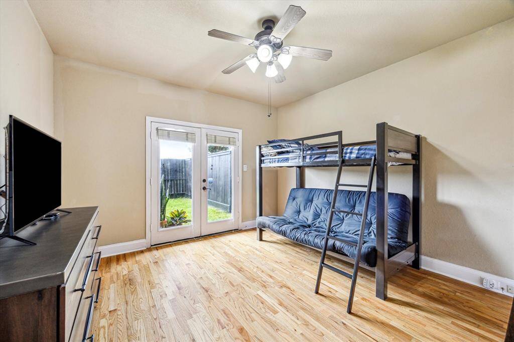 2nd bedroom on lower level with French door to backyard. Tons of natural light.