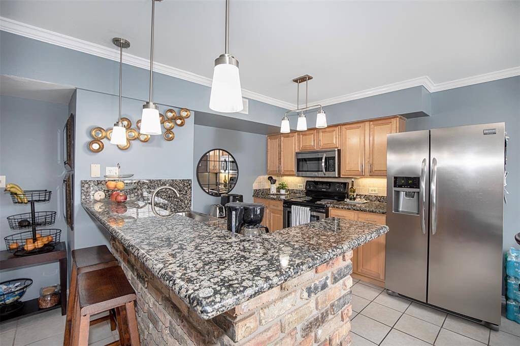 The kitchen features sleek granite counters that offer both style and durability.