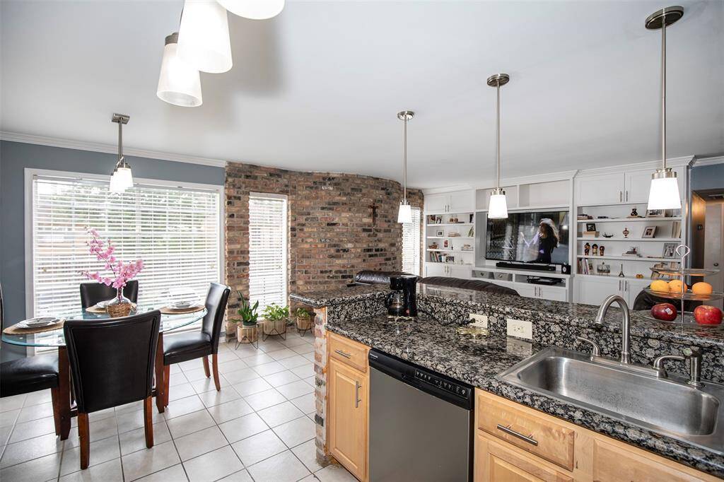 A spacious bar area extends from the countertop, providing additional seating and a casual spot for guests to gather.