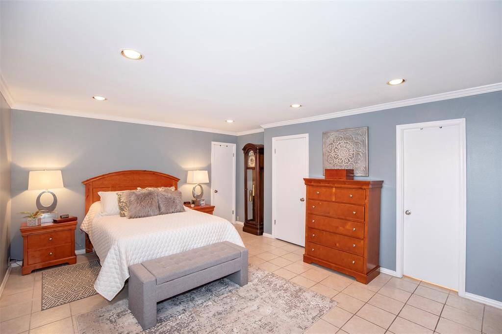 This bedroom has ample space for king size furniture.