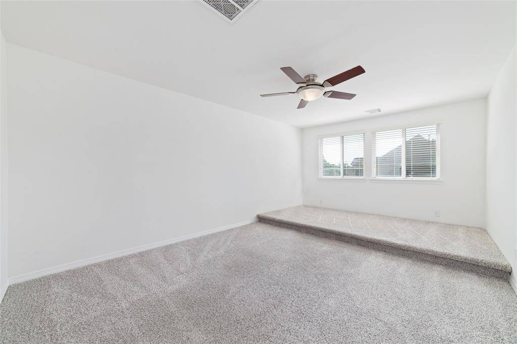 Upstairs just off the game room is the media room with double doors.
