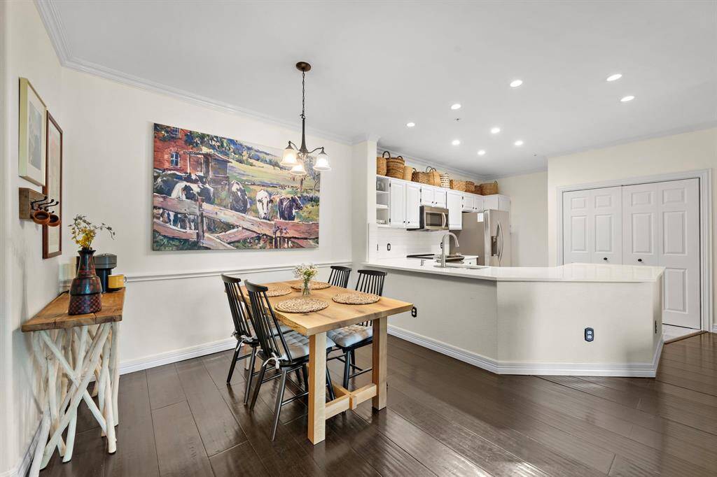Savor quick meals at the open-concept dining area or the breakfast bar, providing multiple seating options and an inviting ambiance.