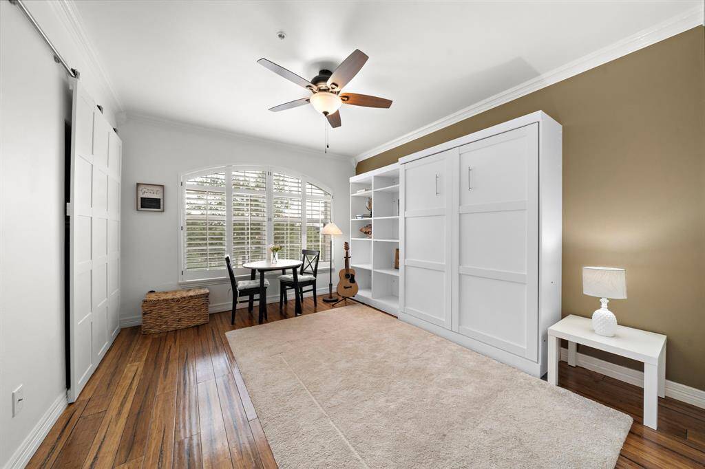 Tasteful and functional, the primary suite's Murphy bed can be conveniently tucked against the wall for added floor space. This bedroom is generously sized and offers endless possibilities for a guest room, a flex area, or a home office!