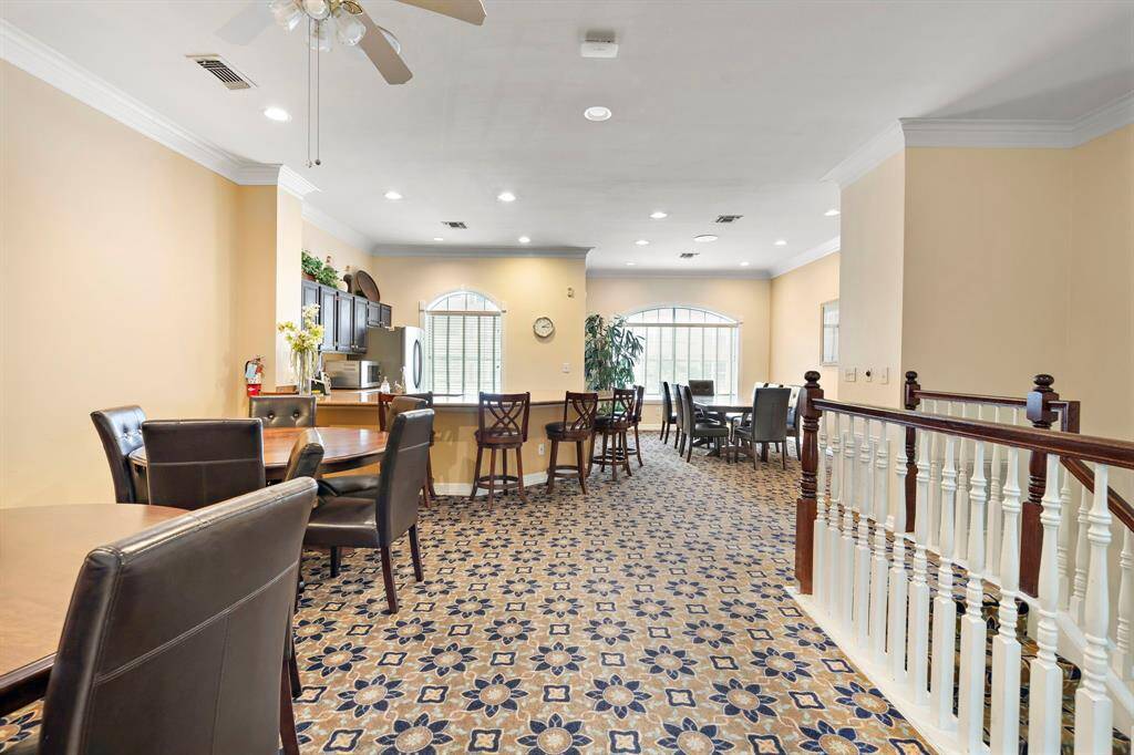 Experience the inviting ambiance of the Renaissance’s second-floor clubhouse, complete with abundant seating options, a kitchenette, and ample natural light—perfect for social events.