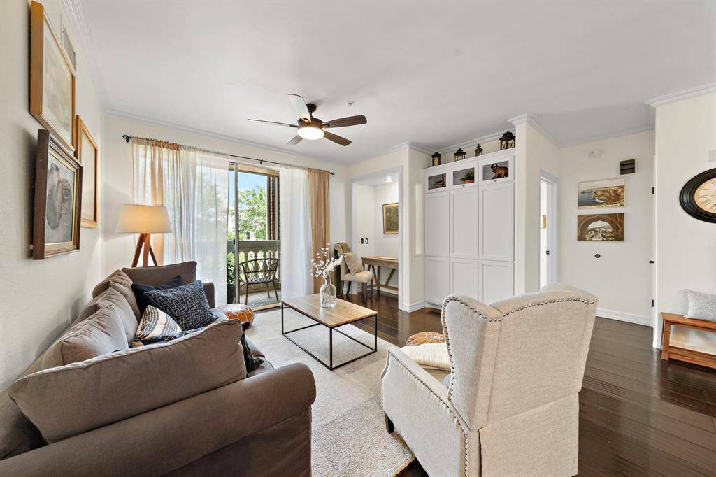 Memorable gatherings await in the living room with custom built-in cabinets, a convenient study nook, and generous accommodations for seating.