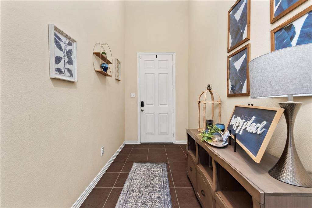 Entry way is long and wide. Have your way with decor and what an entrance.