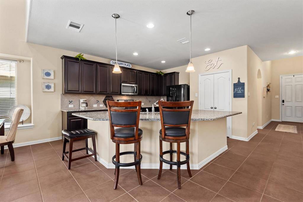 Kitchen is open to living area and dining.