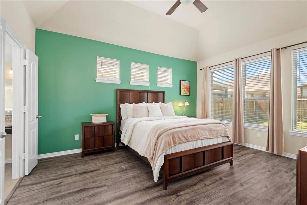 Master bedroom, no carpet, lots of natural lighting.