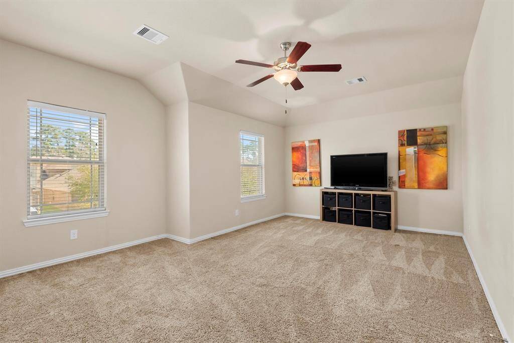 Large game room located upstairs.