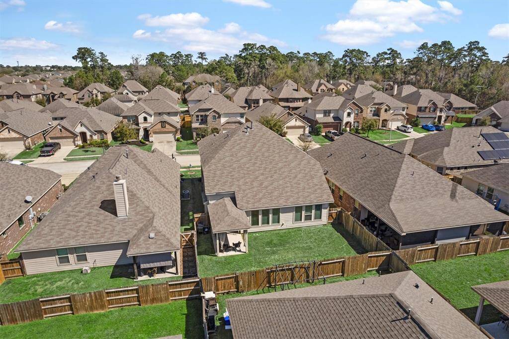 Large backyard with covered patio.