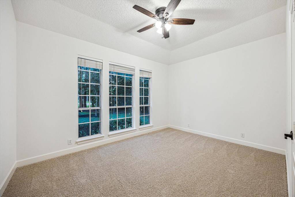 One of three secondary bedrooms in house.