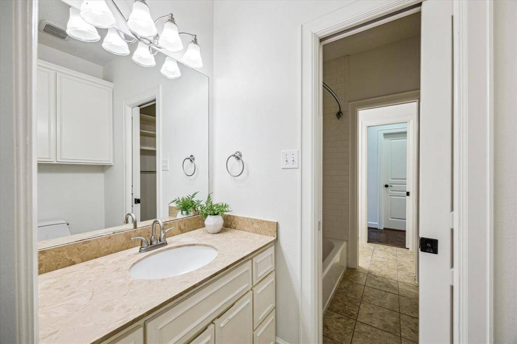 View of vanity and sink.