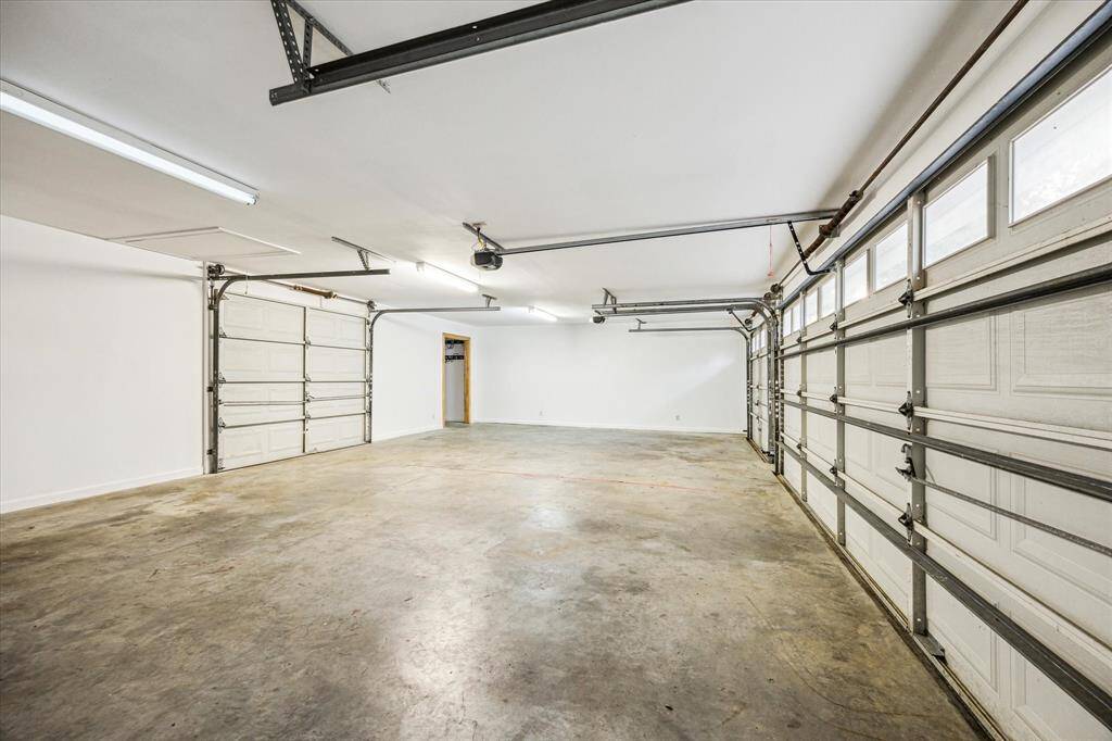 Inside the three car garage all doors have openers.