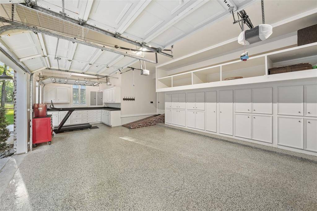 Oversized Garage with plenty of built in storage and counter tops