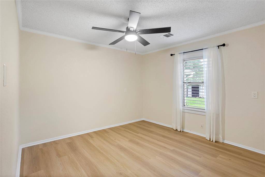 Bedroom 3 new LVP floors, fan light, window treatment