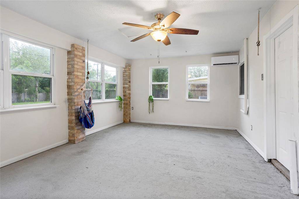 sun room with many windows and natural sun light. Mini split AC unit to enjoy year round and used separate from whole house AC/heat when not in use.