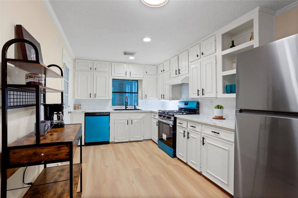 kitchen has new gas stove, dishwasher, new sink & faucet