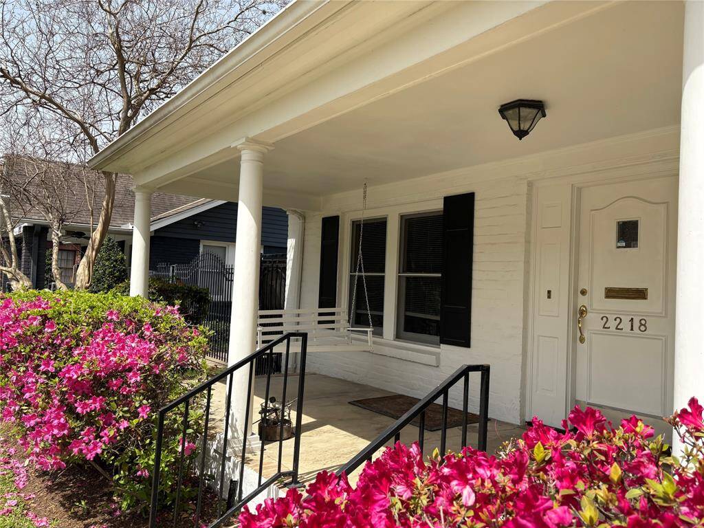 Don't you feel welcome already? The wide front porch has plenty of room for furniture and plants. The azaleas have graced this home for years!