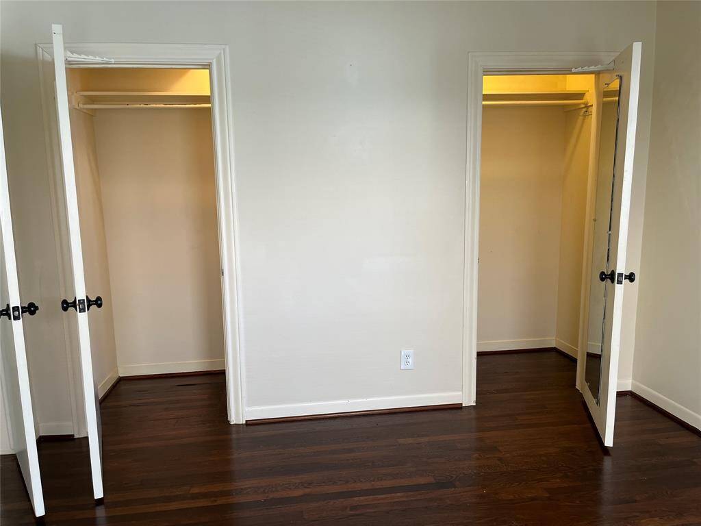 The primary bedroom in the rear of the house, has two closets, with automatic lights.