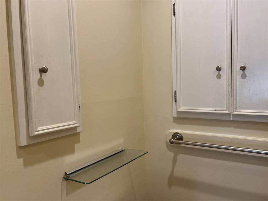 Penty of towel racks and cabiinets