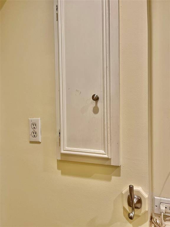 Another handy cabinet to the left of the vanity.