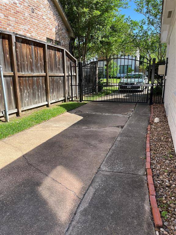 The driveway inside the auto gate can be used for extra parking or a tricycle racetrack