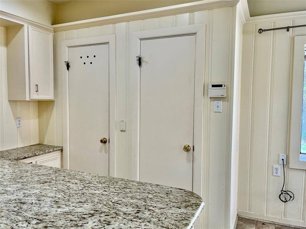 These doros house the water heater and make a great space for cleaning supplies.