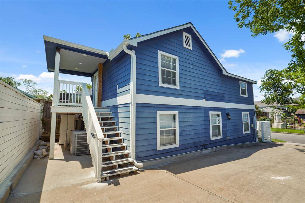 Open-plan living area with modern kitchen appliances, sleek hardwood floors, and a comfortable seating space. The interiors are bright with recessed lighting, and there's a small dining nook ideal for casual meals.