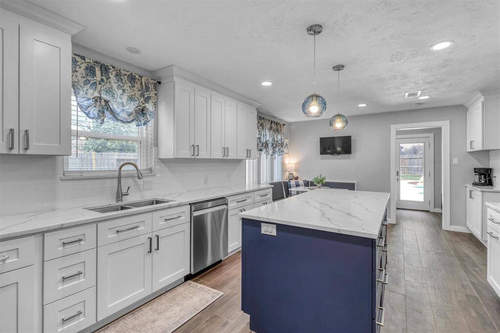 Enter into your renovated kitchen.  Love the window over the sink, too!