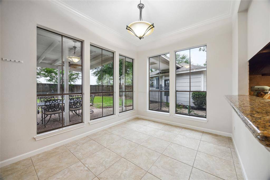 The kitchen features granite counters, stained cabinets, new recessed lighting and a central island perfect for Sunday meal-prep.