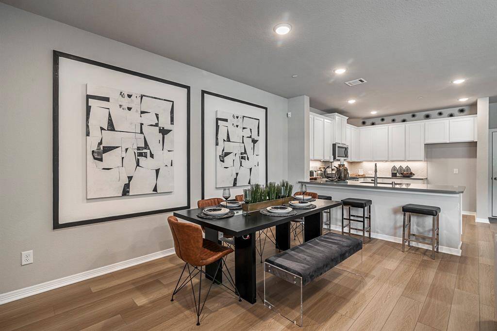 Representative photo of the Houston floorplan by History Maker Homes, dining area, approximate completion date is June 2025