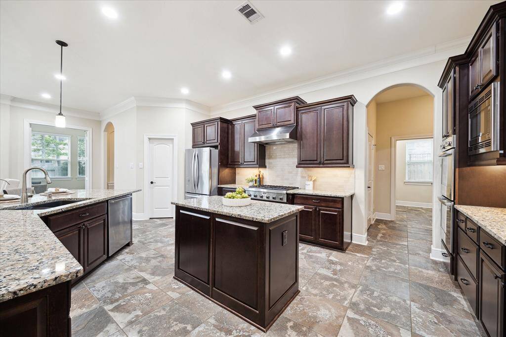 The double island offers and chef convenient workspace winderfully arranged near the cooktop, sink and refrigerator.