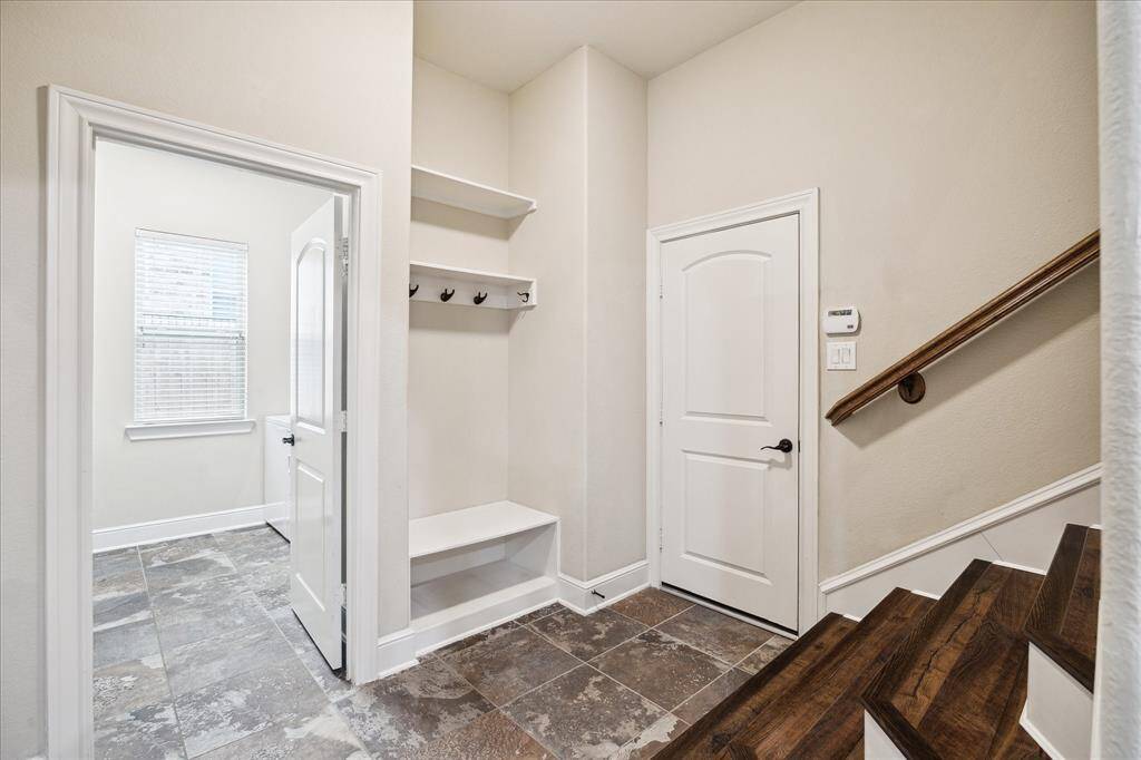 Mud room, door to garage and large oversized utility room