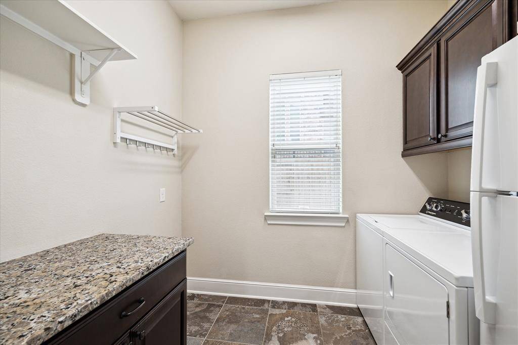 This home has it all. Even the utility room is oversized and has space for a freezer, a worktop area and beautiful cabinetry.