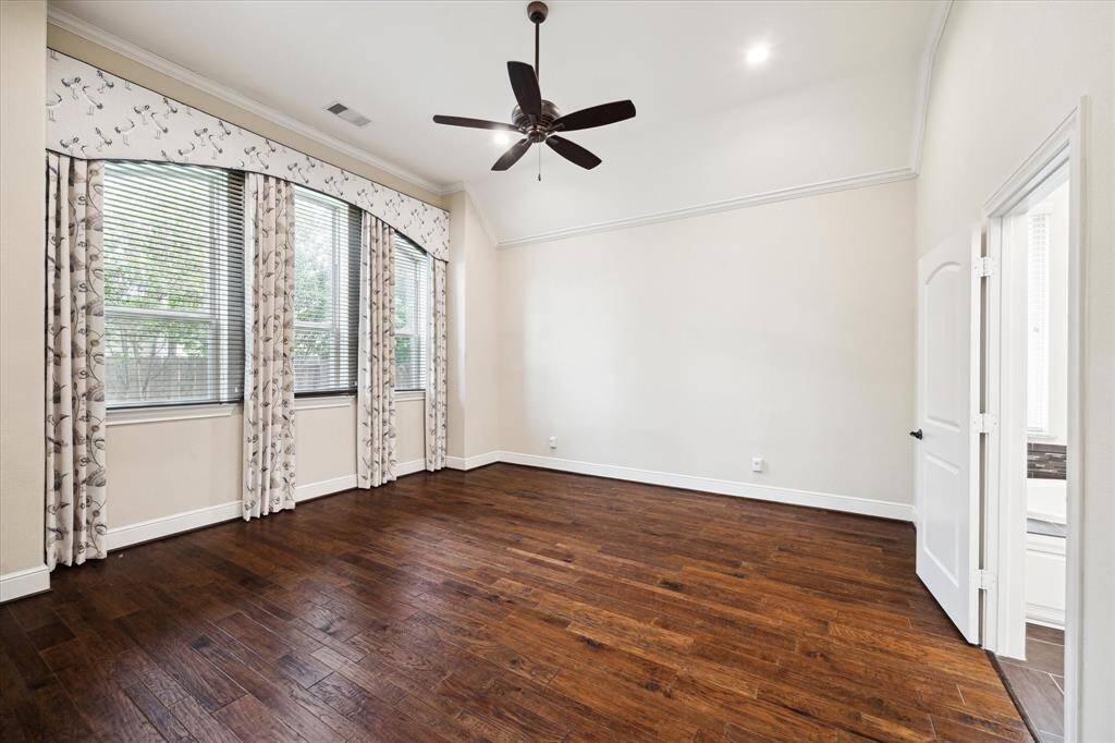 Large primary bedroom.  Windows look out to the beautiful backyard.
