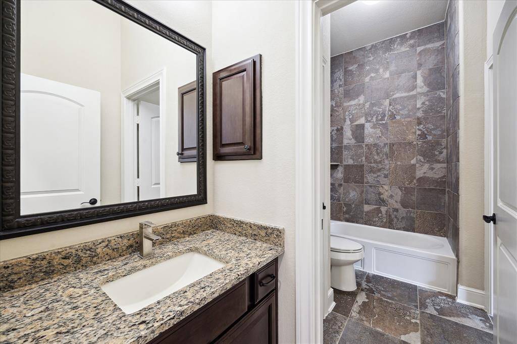 Dual access bathroom shared by bedrooms 3 &4.