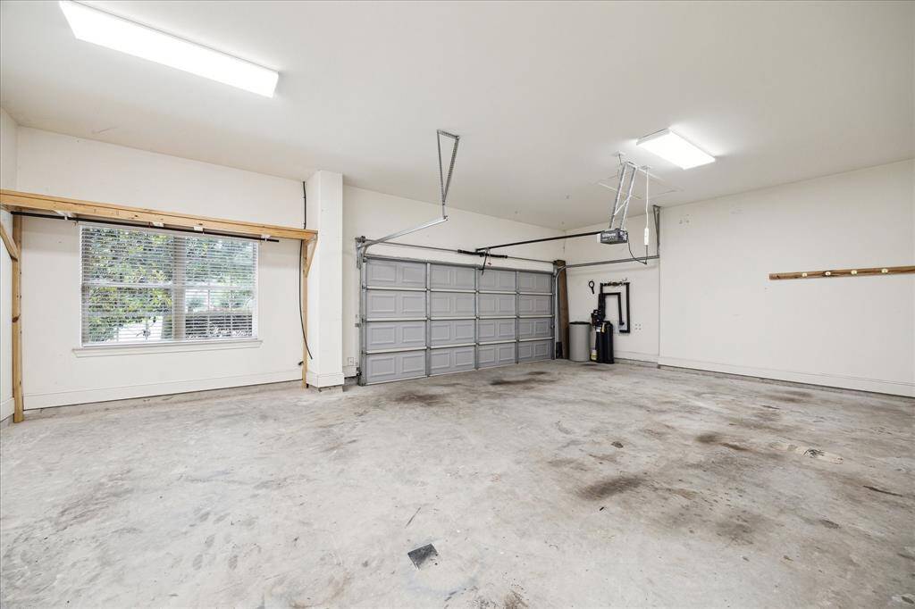 Large oversized garage with workshop area to the side, if desired.  Could also be used as 3rd parking space.