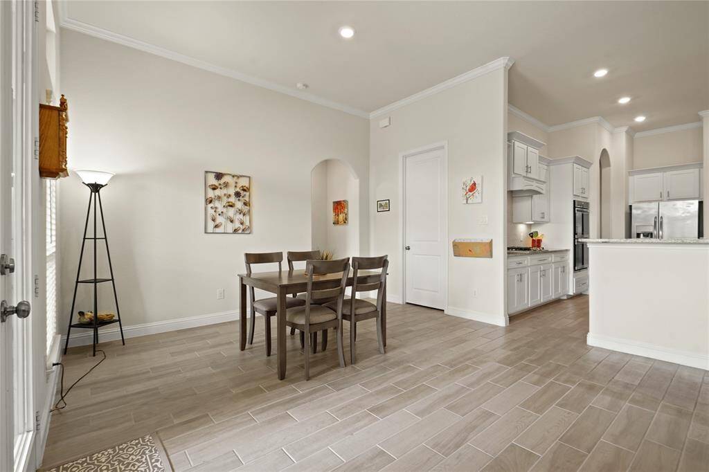 Cozy breakfast area between the kitchen and back patio, perfect for informal dining.