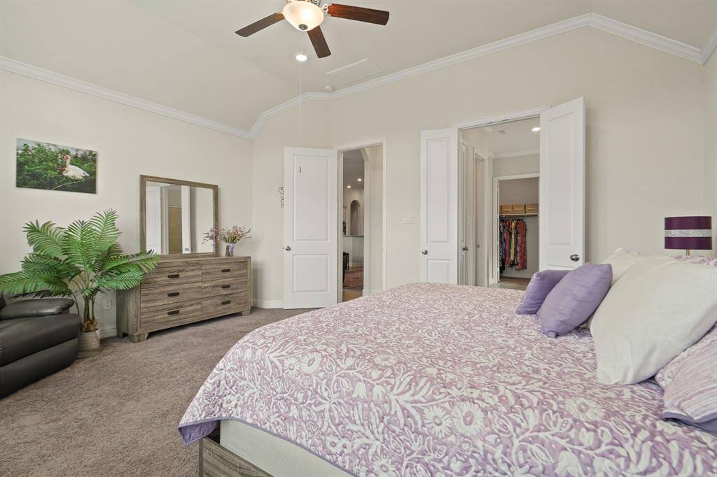 The primary suite is bright and inviting.