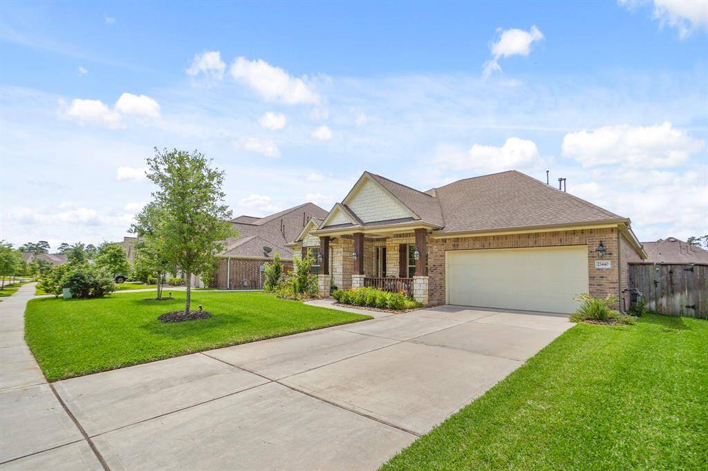 This home has a welcoming front porch and is set in a well-maintained neighborhood with sidewalks and greenery.