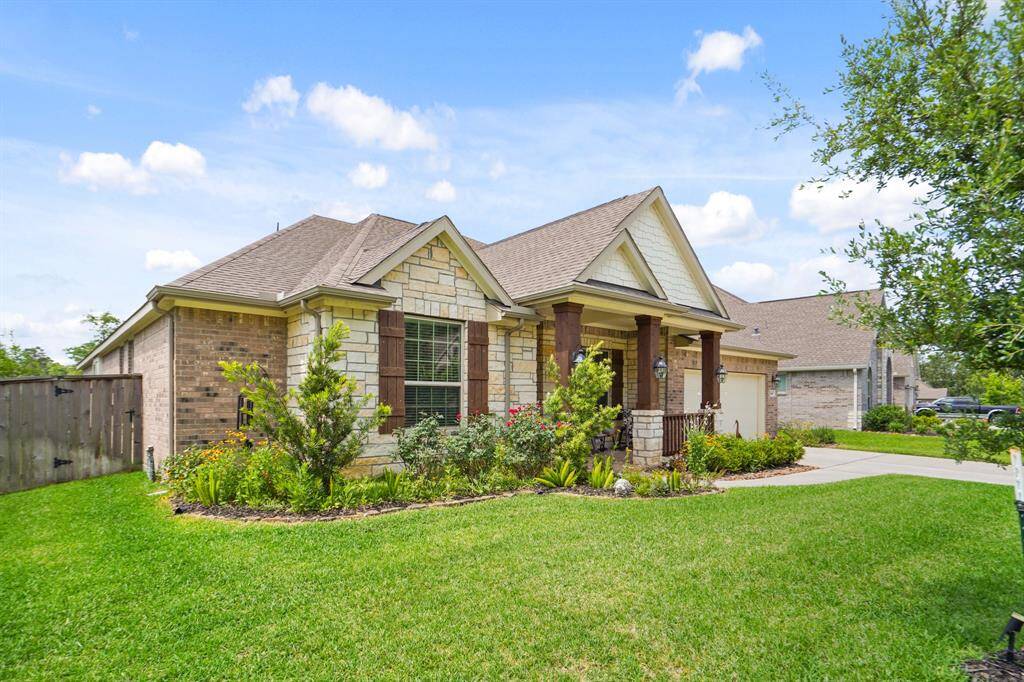 Experience the stunning curb appeal with beautifully landscaped gardens at the front of this home.