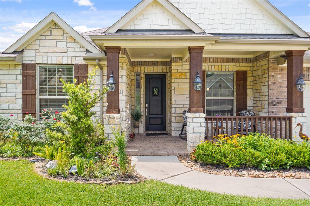 Charming brick and stone exterior offers timeless beauty and easy upkeep.