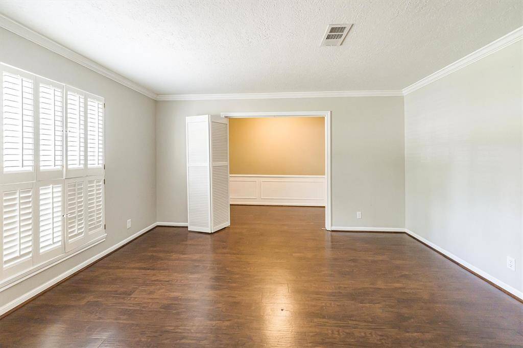 Plantation shutters on the large window and a bi-fold door to add privacy to the space