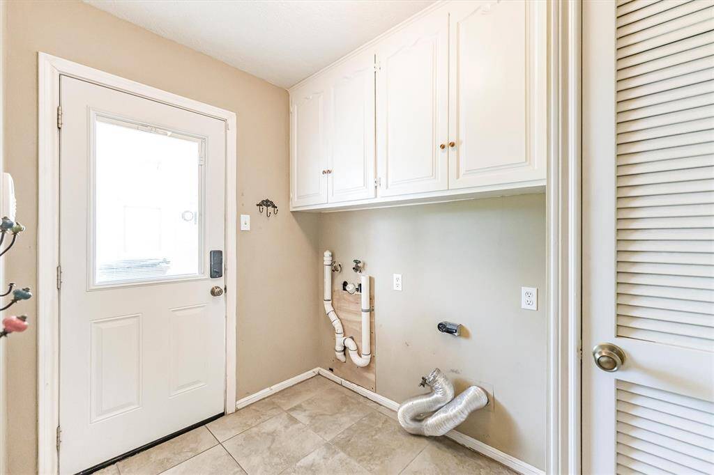 Utility room with backyard access
