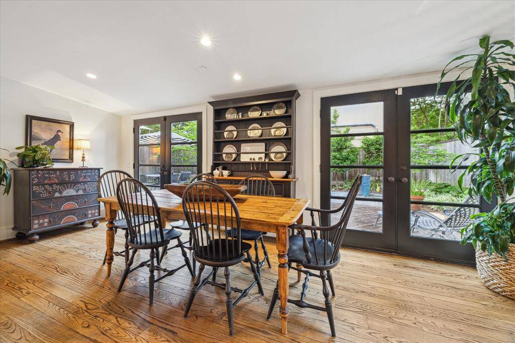 Dining Room with view of outdoors through the matching French Doors. The recessed and natural lighting are spectacular.