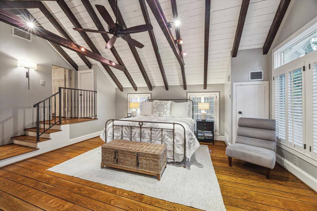 The wall of windows overlook the treetops and enhance this charming room. This space has a separate ac which was recently replaced.