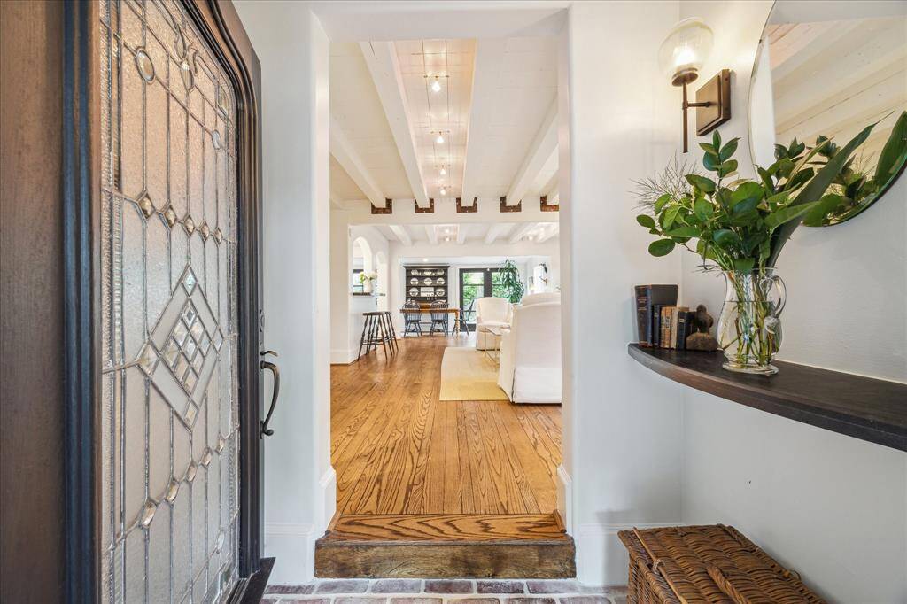 Sophisticated and homey interiors await, but the leaded glass and wood front door reminds us of Montrose's history. Built in 1939, this home has gone through multiple restorations to make it totally current and move-in ready.