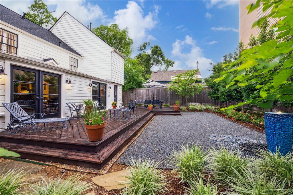 These flagstone steps lead to the south side of the home with a wrought iron gate and hvac access.