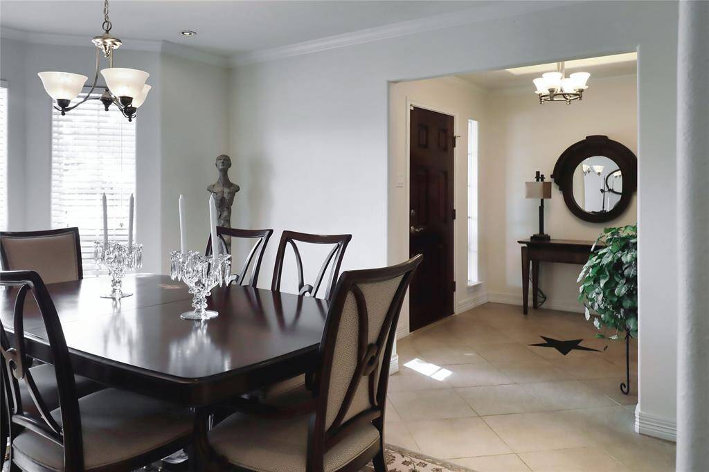 Dining room and view of front entry and door