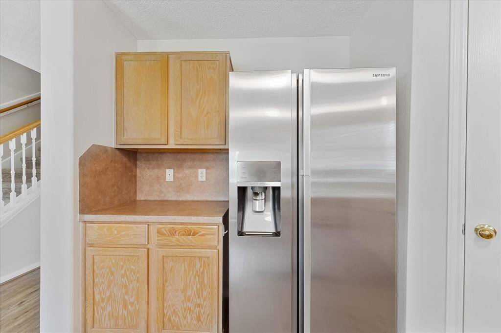 Refrigerator stays with the home.
